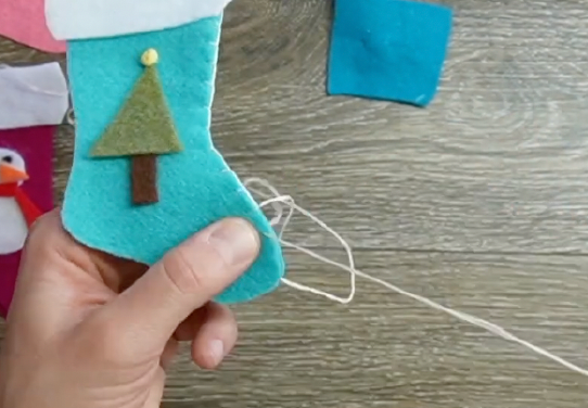 sew using a blanket stitch the two stocking pieces together