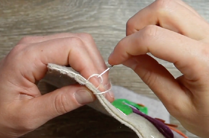 sew the two pieces of the mug rug together using the blanket stitch