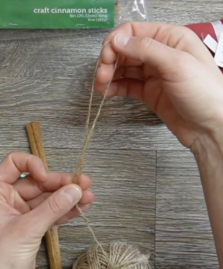 cut twine to create a hanging loop