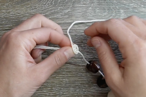 wrap the cord to start creating a knot